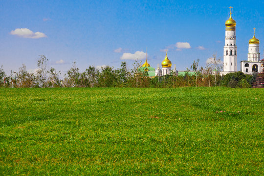 Rural meadow and Ivan the Great's belltower in the park Zaryadye.