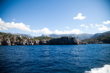 Fototapeta premium blue water of the sea against the backdrop of the Mediterranean mountains. Spain. view from the water