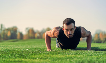 The man pushing up on the grass