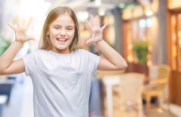 Young beautiful girl over isolated background showing and pointing up with fingers number ten while smiling confident and happy.