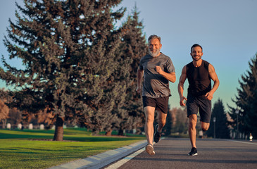 The father and son running on the road