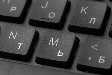 Black laptop keyboard close up