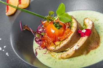 fish fillet with sauce baked and decorated