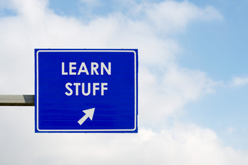 Learn Stuff words displayed on blue road sign