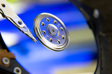 Hard drive from computer or laptop lies on the table in the repair shop. Performs fault diagnostics and performs urgent repairs recovery of lost data during deletion HDD closeup