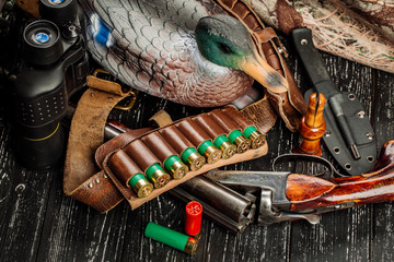 Hunting equipment on the wooden background. Hunt concept.
