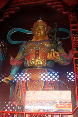 Heavenly Kings holding pagoda statue in Dajue Temple, China