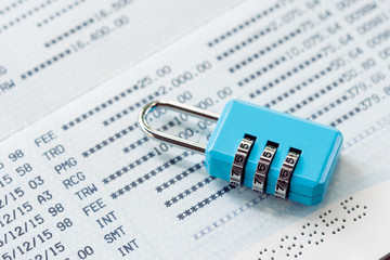 Key lock and chain at the bank account lockout concept lock bank financial statement placed on the white space to add text