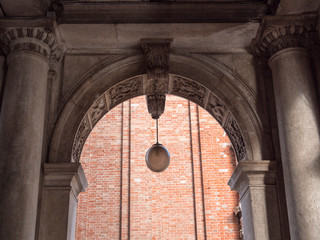 Ancient arch with ornate columns in baroque architecture style. Nobody.