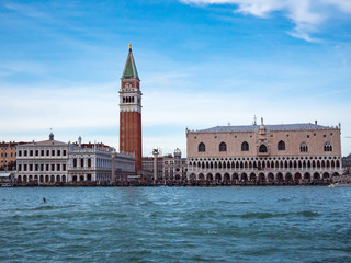 Fototapeta na wymiar San Marco square or piazza and Doges Palace panoramic view from speed boat on sea or canal Beautiful renaissance italian architecture landmarks of Venezia Venetian cityscape travel background Day time