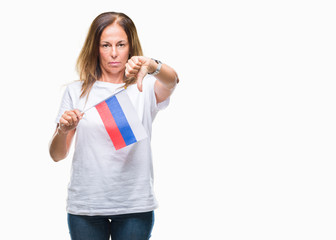 Middle age hispanic woman holding flag of Russia over isolated background with angry face, negative sign showing dislike with thumbs down, rejection concept