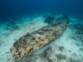 Seascape of coral reef in Caribbean Sea around Curacao at dive site Tugboat Saba with sunken Tugboat and coral and sponge