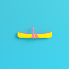 Yellow canoe with paddles on bright blue background in pastel colors