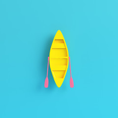 Yellow canoe with paddles on bright blue background in pastel colors