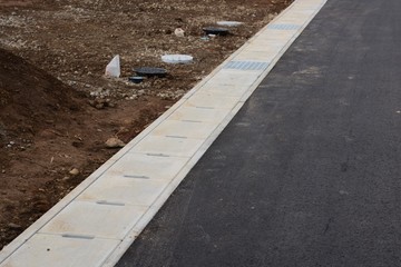 Housing land development work / Street gutter construction