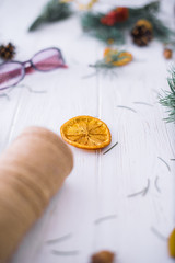 Obraz na płótnie Canvas Dry orange on a white wooden background. New Year's concept