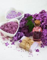 Fototapeta na wymiar Essential oil with lilac flowers