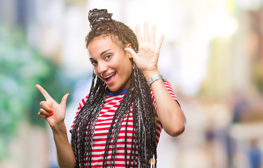 Young braided hair african american girl over isolated background showing and pointing up with...
