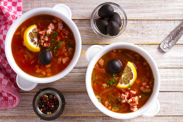 Russian dish  solyanka - thick, spicy and sour saltwort soup. overhead, horizontal