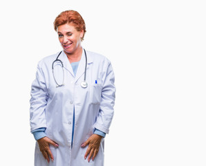 Senior caucasian doctor woman wearing medical uniform over isolated background winking looking at...