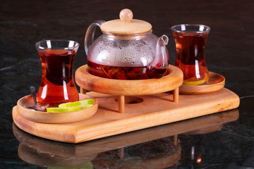 traditional turkish tea cup, tea ceremony, Cup of freshly brewed black tea, warm soft light, darker...