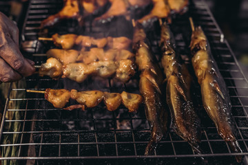 Fish bbq. Street food in Bangkok, Thailand, Asia.