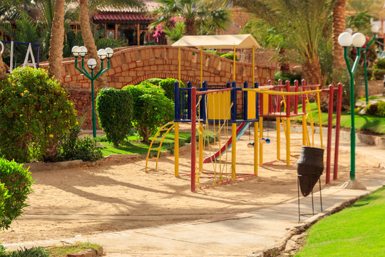 Colorful playground equipment for children in tropical holiday resort