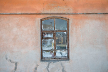 Fototapeta na wymiar Old cracked wall with frozen window