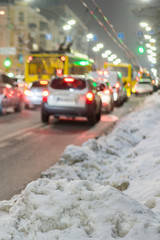 Night road in the city of lights cars traffic jams. Winter traffic in the city. vertical photo