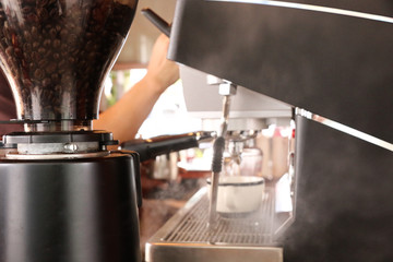 Process pressing ground coffee with tamper