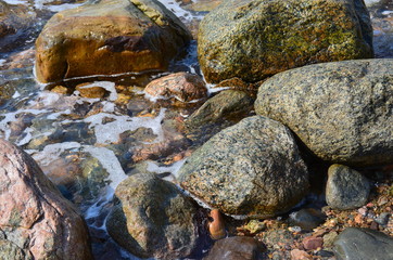Naklejka na ściany i meble Beach rocks low tide