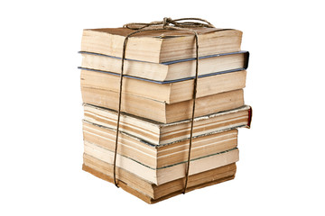 Bundle of old books tied up with string. Isolated on white background