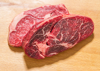 Obraz premium Two raw dry aged entrecote, top view
