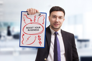 Business, technology, internet and networking concept. Young entrepreneur showing keyword: Boost...
