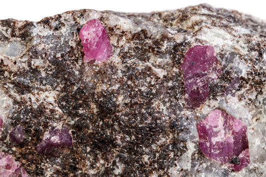 Macro of a mineral Ruby stone on a white background