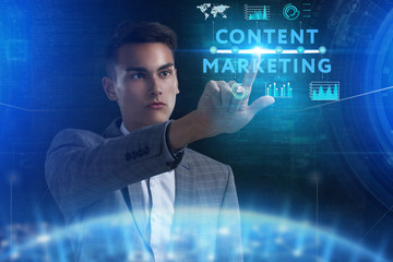 The concept of business, technology, the Internet and the network. A young entrepreneur working on a virtual screen of the future and sees the inscription: Content marketing