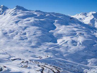 Snow slopes with ski lifts. Aerial View of Mountain chain above Meribel valley , France. January, 2018