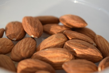 Almonds on white background