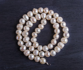 white pearl beads on a black background