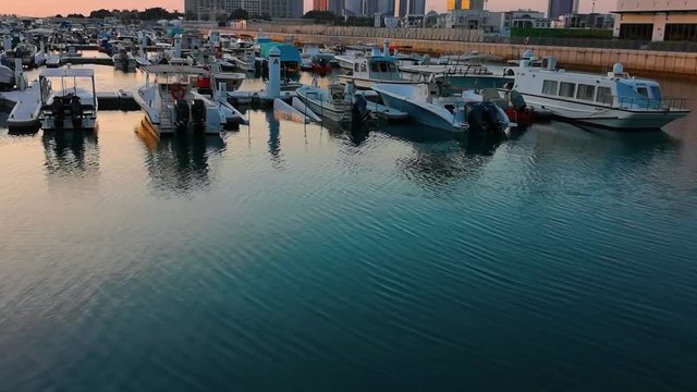 Beautiful view of Abu Dhabi city Etihad towers, famous landscape and Marina boats