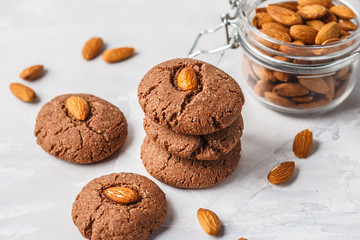 Chocolate cookies with almonds on white background. Vegan dessert concept.