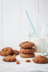 Chocolate cookies with almonds on white background. Vegan dessert concept.