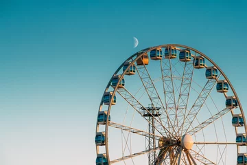 Deurstickers Helsinki, Finland. Moon Rising Above Ferris Wheel © Grigory Bruev