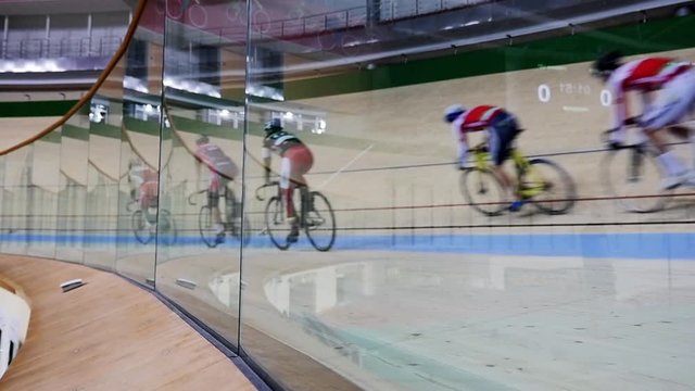 Men ride a bicycle, cycling. Cycling track Pursuit competition sequence.