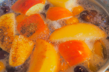 A delicious and healthy compote made of apples, plums and cherries