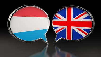 Luxembourg and United Kingdom flags with Speech Bubbles. 3D illustration