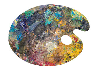 Wooden art palette with blobs of paint on white  isolated background