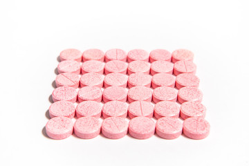 Obraz na płótnie Canvas red pills isolated on white background