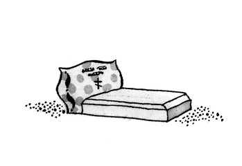 Grave with a pillow. Tombstone.