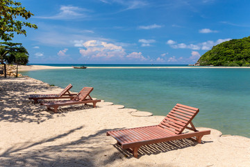 Sunbeds on a tropical beach, Thailand